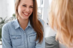 a woman is happy to learn about case management for addiction treatment