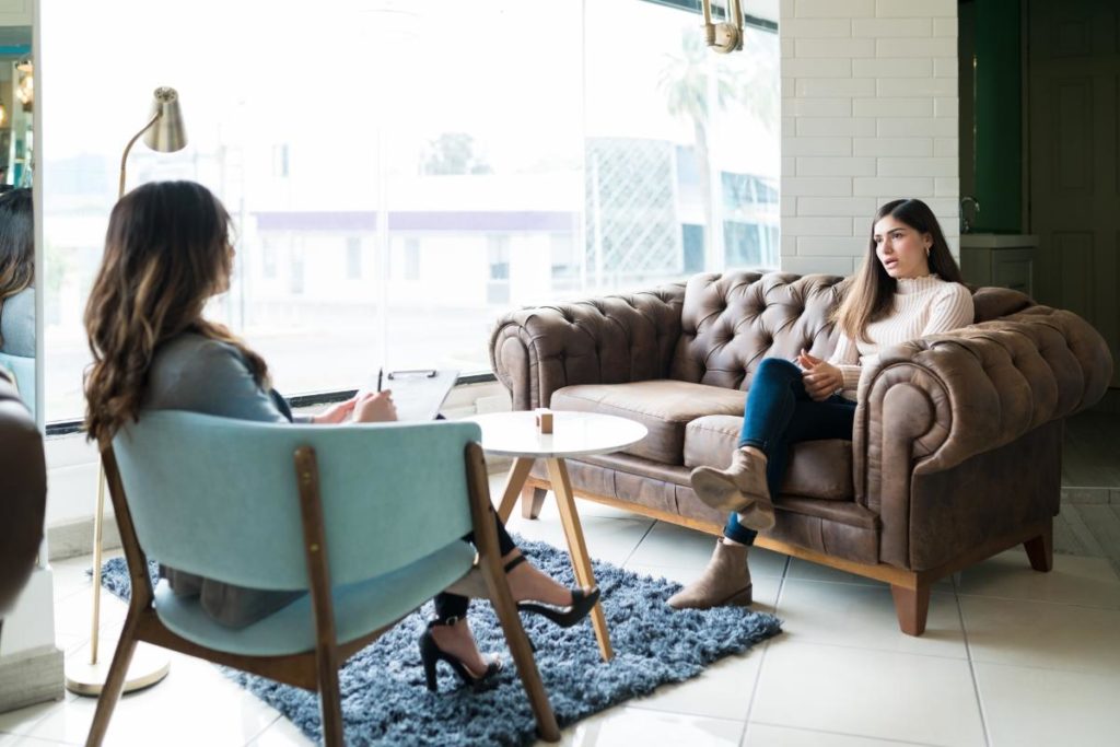 a case manager sits with a patient and identifies case management skills for the patient to work on