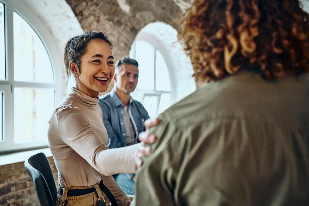 Reassuring woman discussing the benefits of trauma therapy