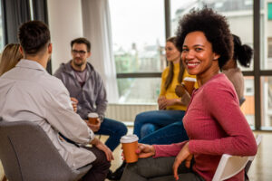A group of people discuss recovery group topics