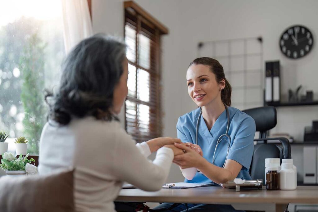 a woman gets help understanding her insurance coverage for sober living
