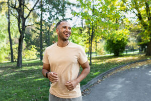 a person smiles while walking outside after wondering when does sobriety get easier