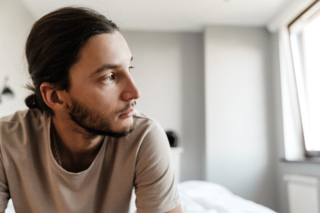 a man struggles with his mental health in early sobriety