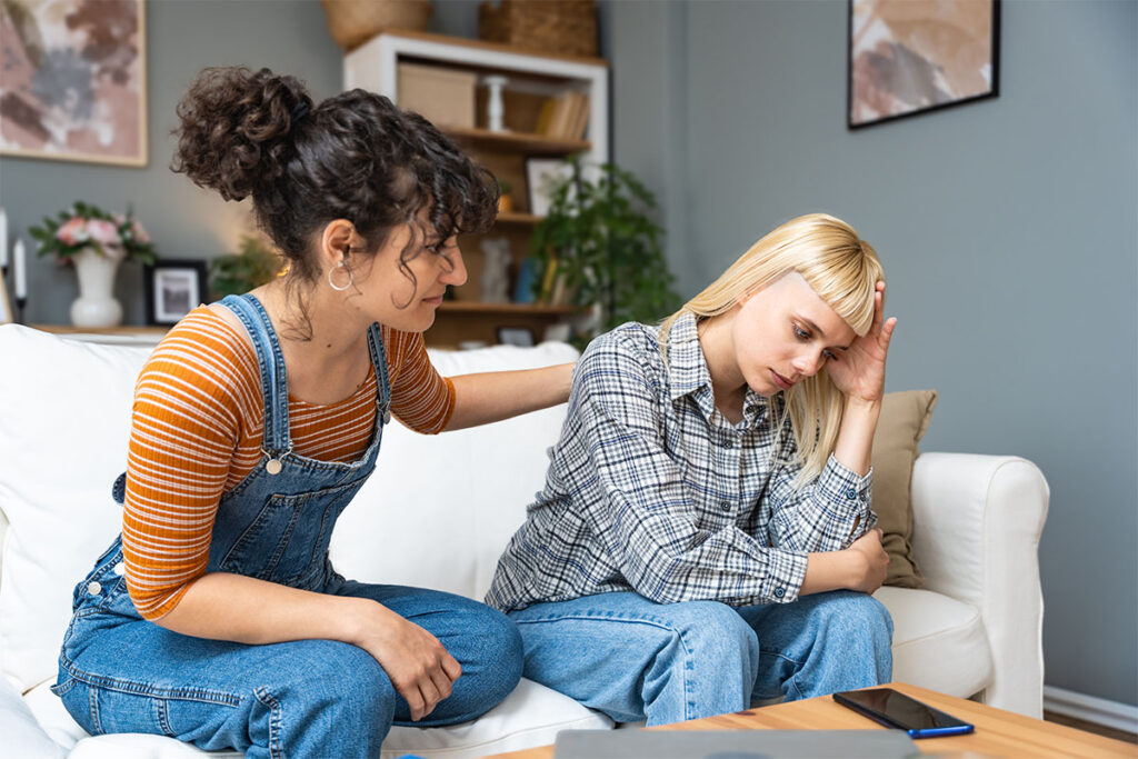 a woman tries to talk her lgbtq friend into seeking professional help for addiction